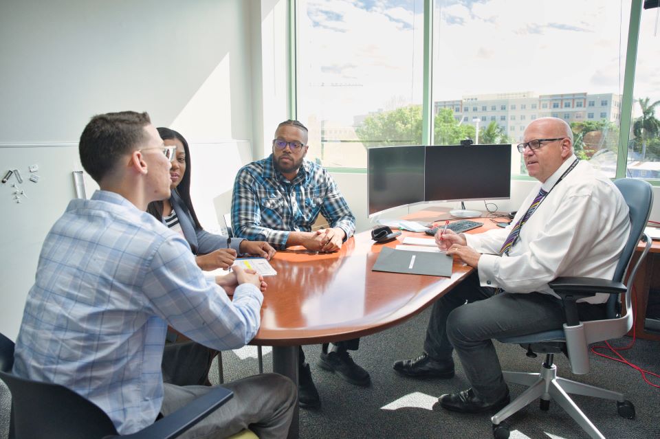 Team seated around a table